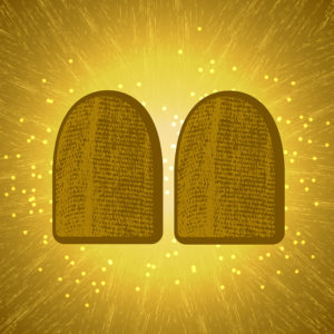 Shavuot. Concept of Judaic holiday. Tablets of the covenant of Moses Bible Torah. Ten Commandments. Back light shines. Brown background, grung texture